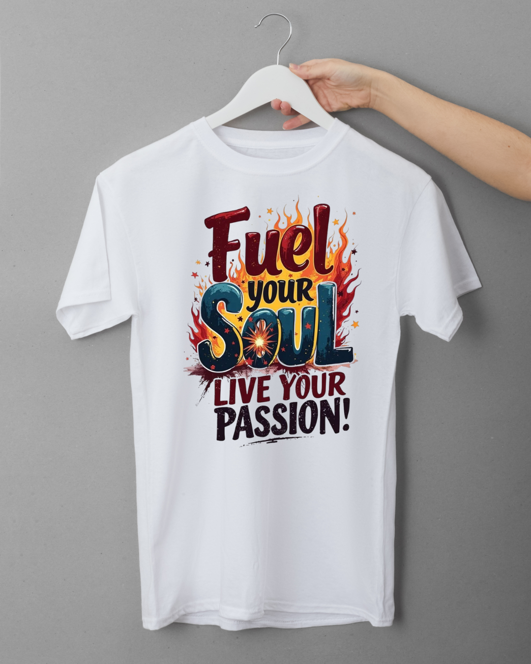 White t-shirt with motivational quote on a hanger against a gray background