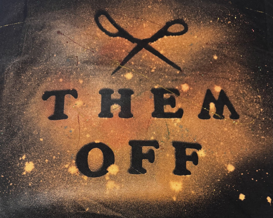 Text 'THEM OFF' with crossed scissors on a textured background