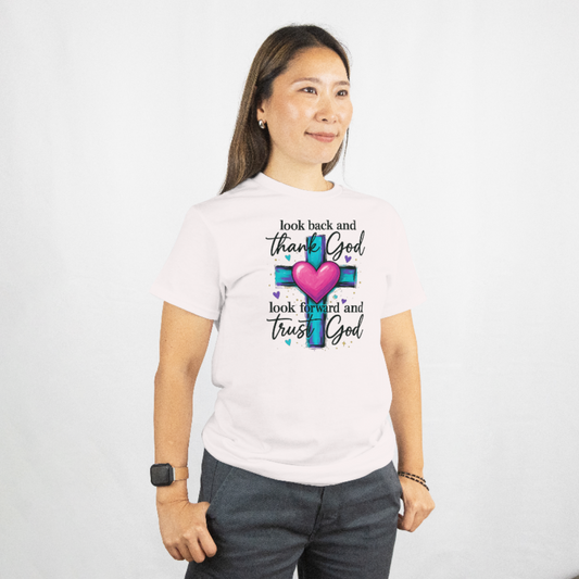 Woman wearing a white t-shirt with a motivational quote and heart design on a plain background