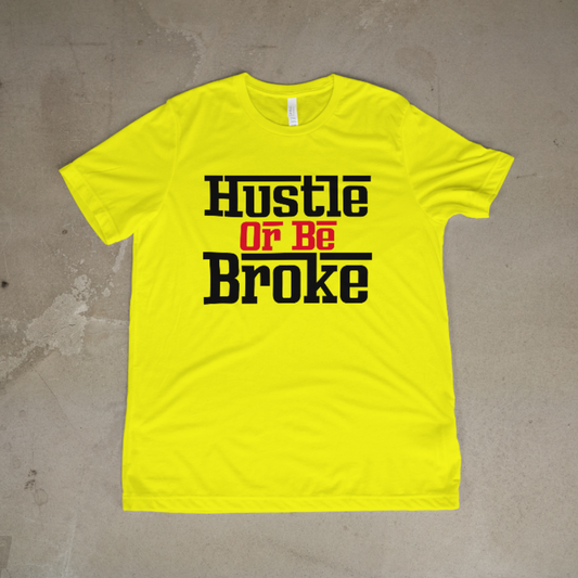Yellow t-shirt with 'Hustle Or Be Broke' text on a textured surface