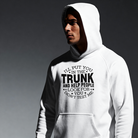 Person wearing a white hoodie with text on a dark background