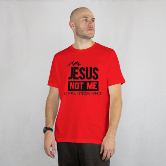 Man wearing a red t-shirt with black text on a plain background