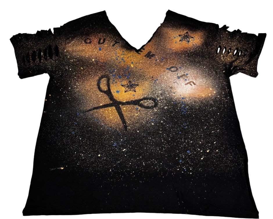 Black t-shirt with artistic designs and text on a textured surface