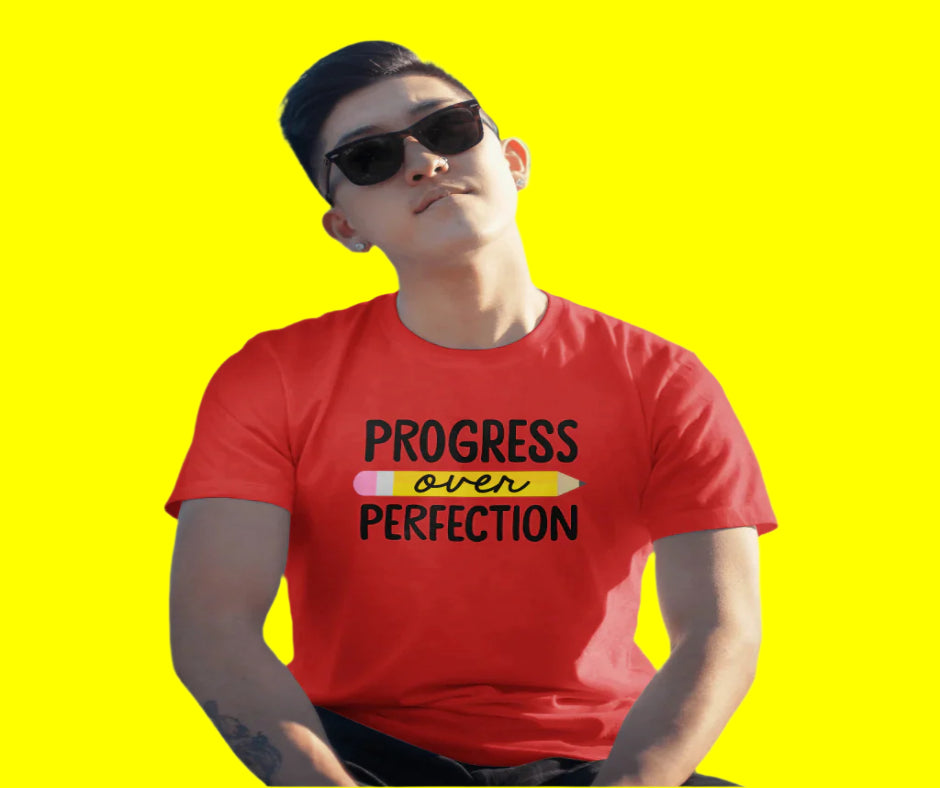 Inspirational 'Progress Over Perfection' tee, motivational shirt with bold text design for growth and self-improvement."