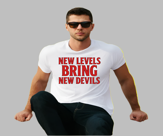 Man wearing a white t-shirt with red text sitting on steps.