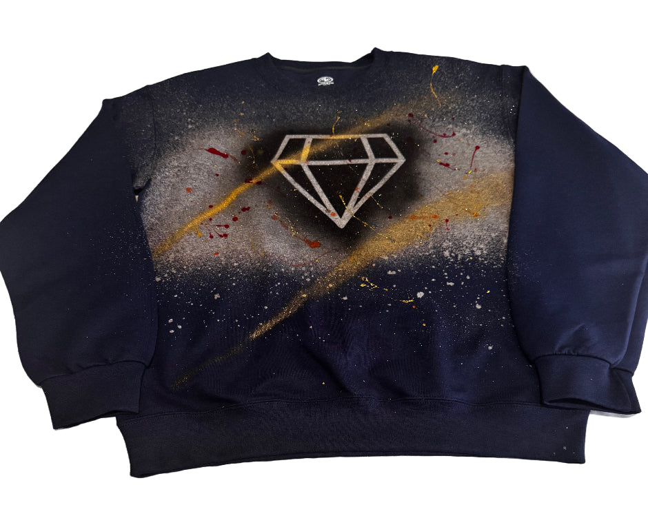 Black sweatshirt with a diamond symbol design on a textured surface