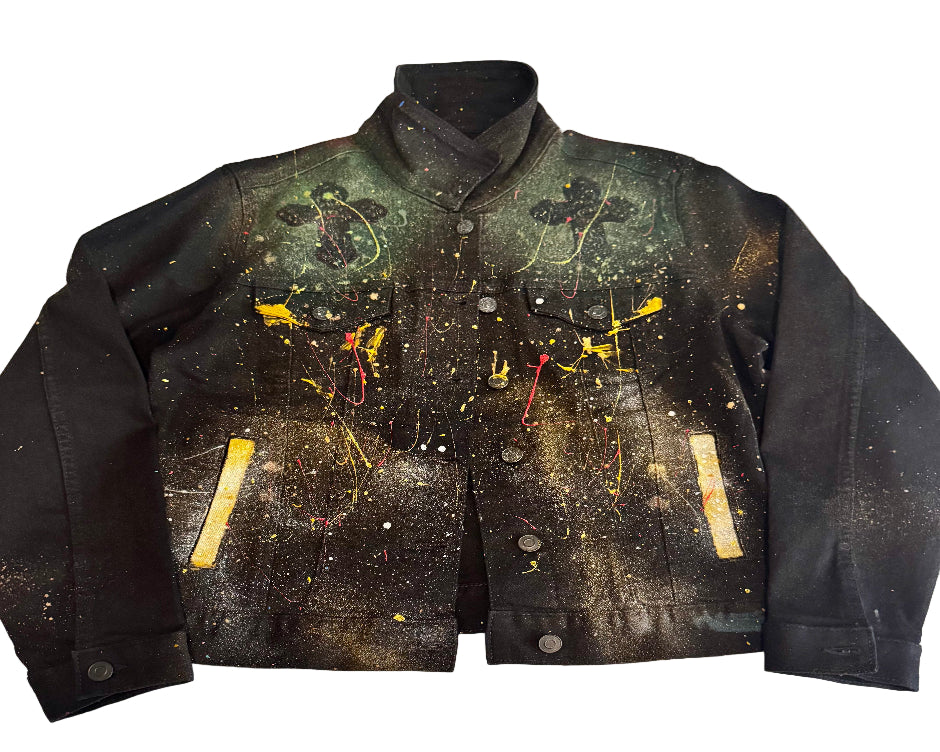 Black jacket with colorful splashes on a textured white background