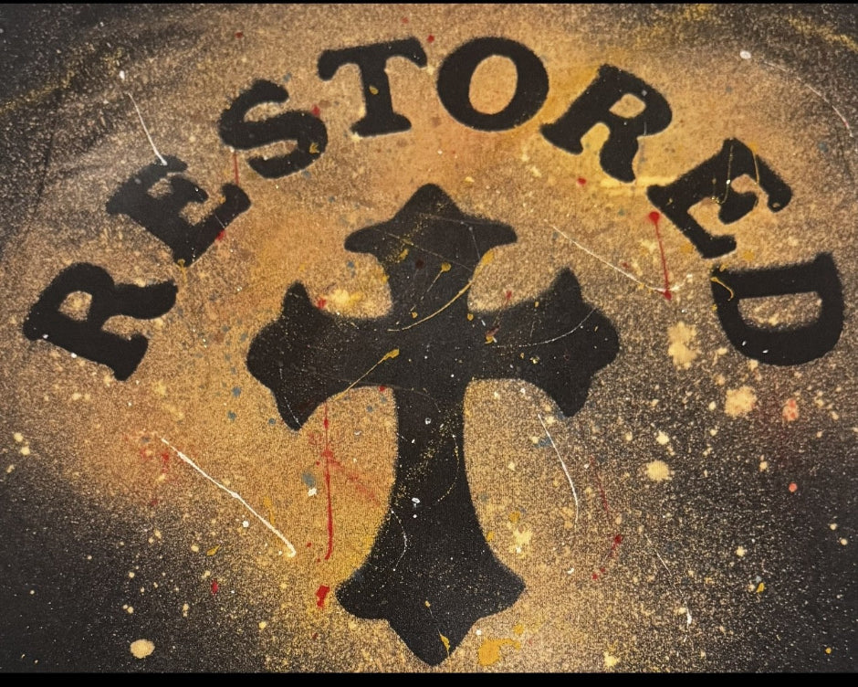 Black cross with 'RESTORED' text on a textured background