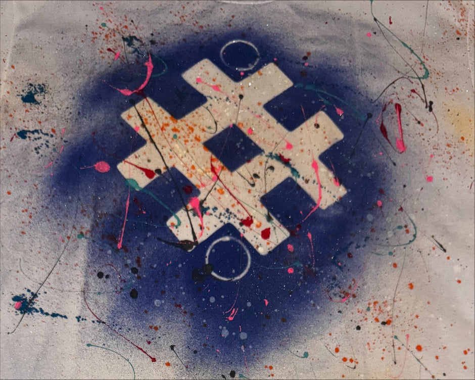 Abstract art with a blue circle and colorful splashes on a textured background