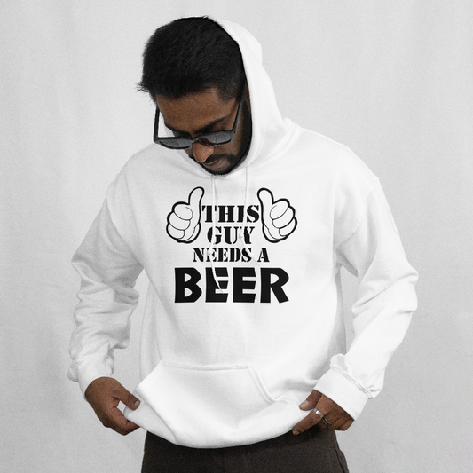 Person wearing a white hoodie with 'This guy needs a beer' text on a plain background
