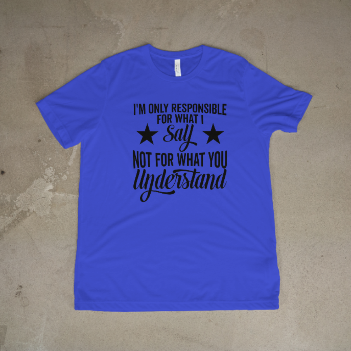 Blue t-shirt with black text on a beige surface