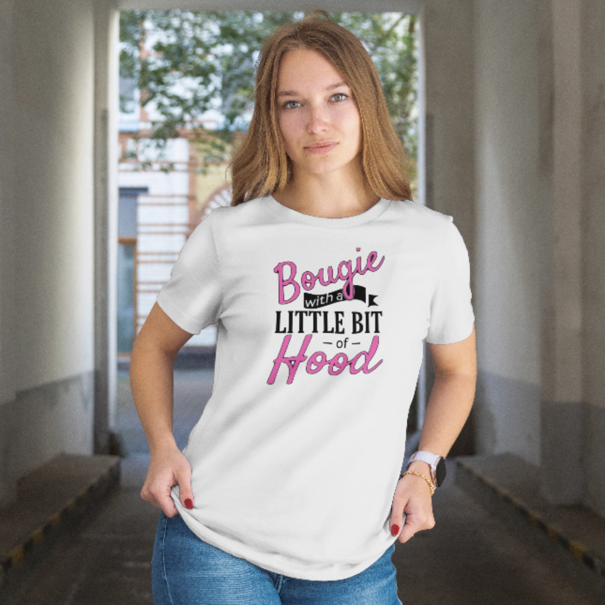 Person wearing a white t-shirt with text in an indoor setting