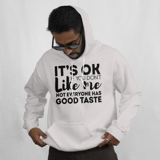 Person wearing a white hoodie with text on a plain background
