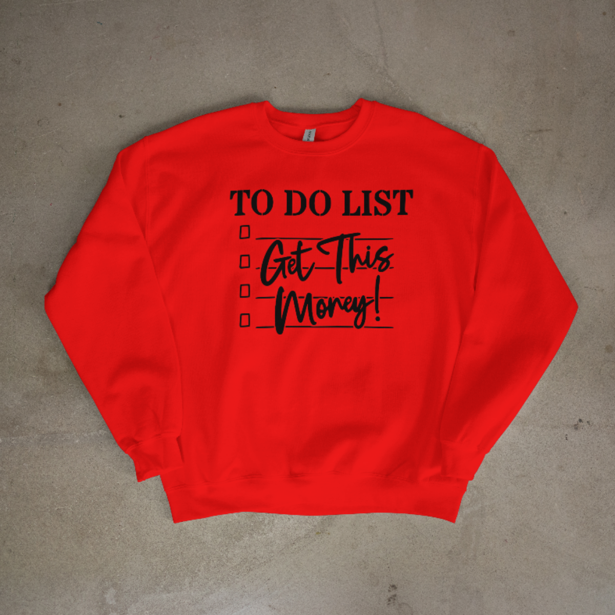 Red sweatshirt with 'TO DO LIST Get This Money!' text on a concrete floor.
