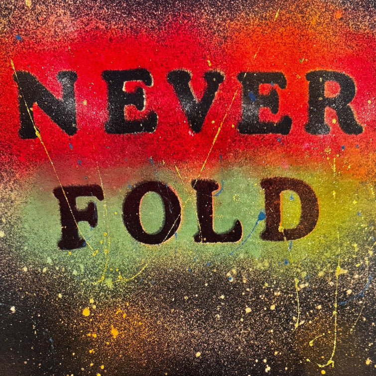 Model wearing black unisex ‘Never Fold’ t-shirt with bold black lettering, red and green accents, and gold highlights, customized by FranSansCreation.”