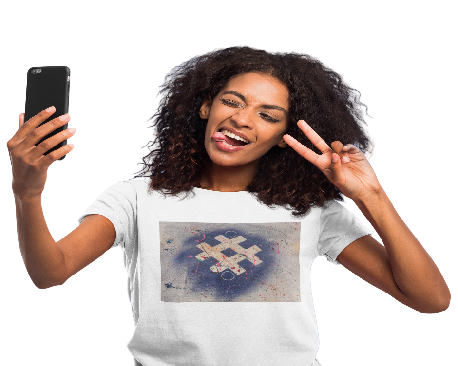 Woman taking a selfie with a phone, wearing a white t-shirt with a graphic design on a blue background