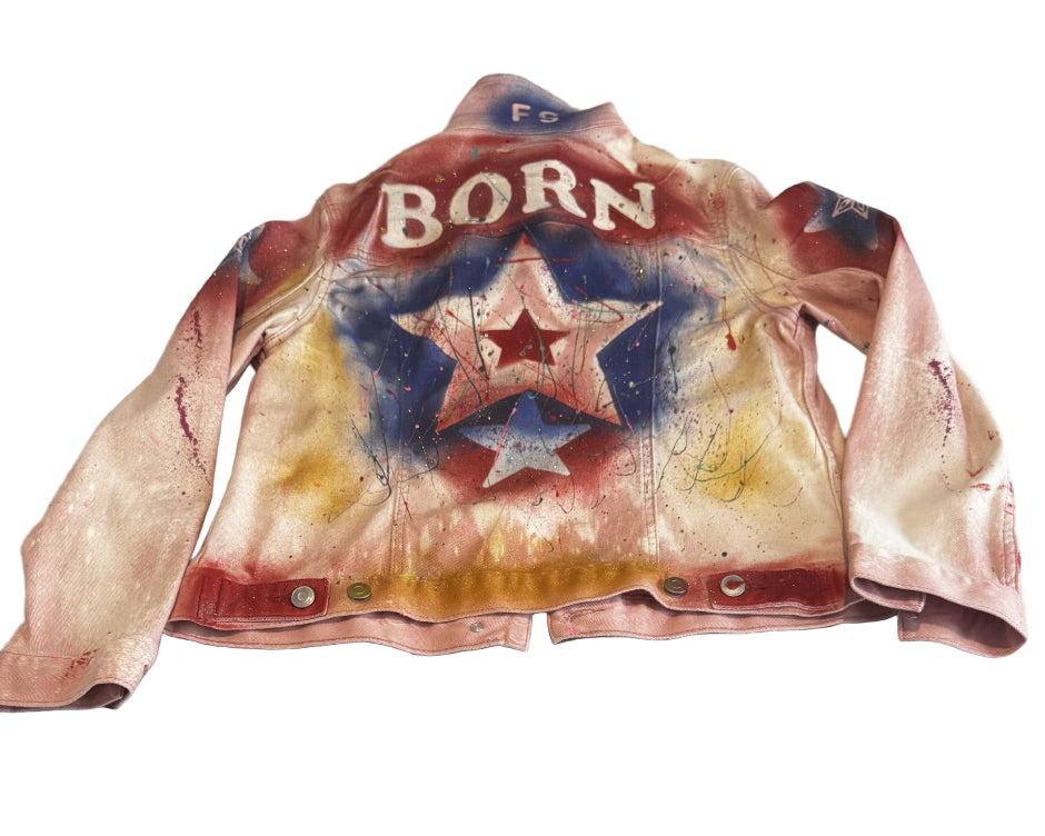 Vintage leather jacket with 'Born' and star design on a light background