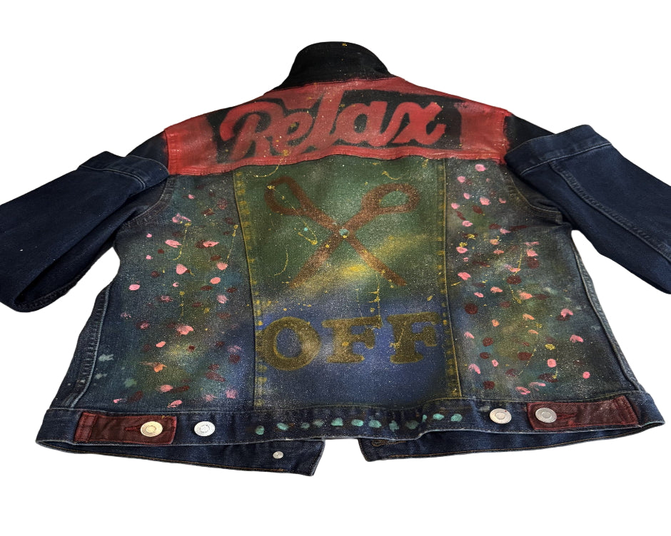 Denim jacket with colorful graphics and text on a light background